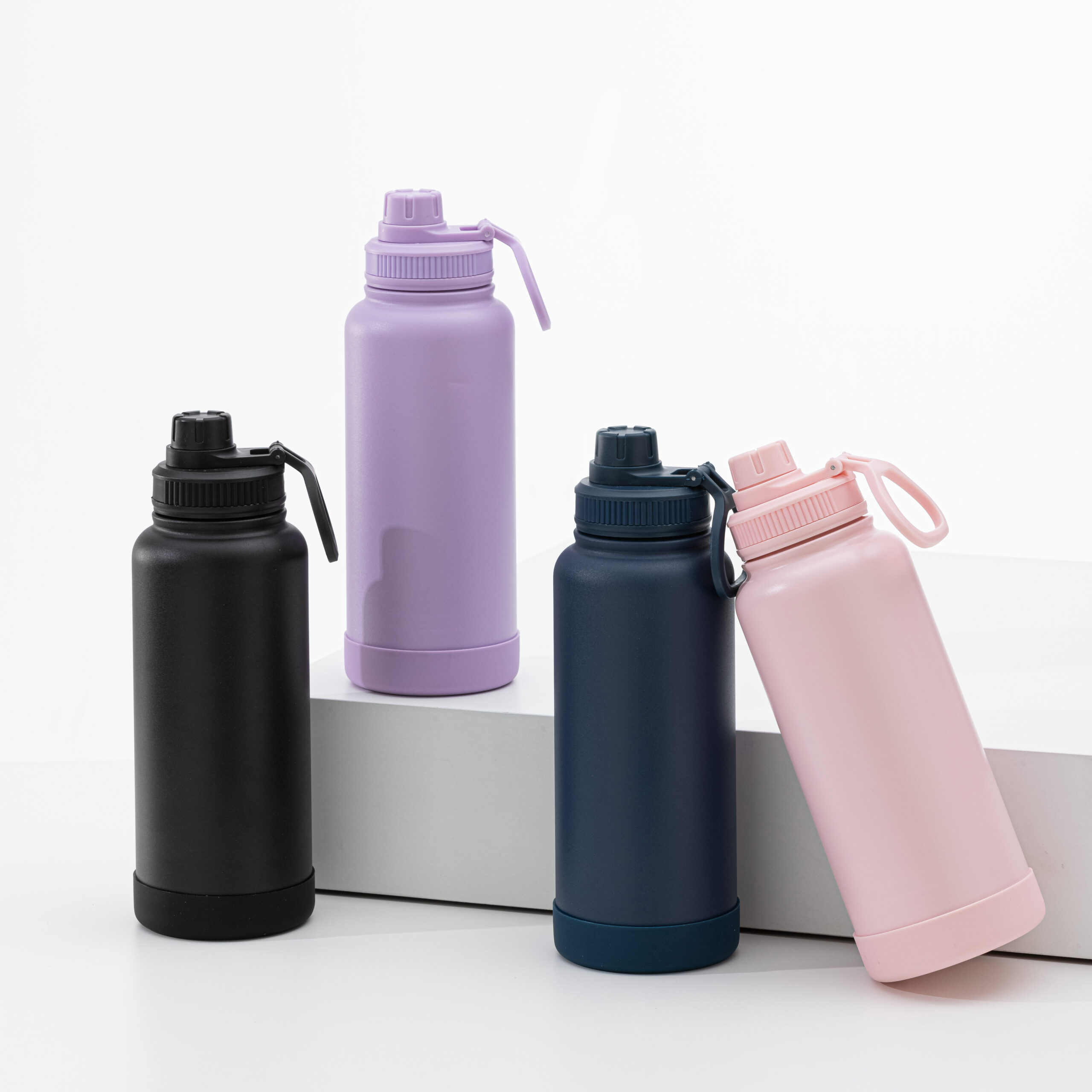 Minimalist water bottles in pastel colors and black, product display