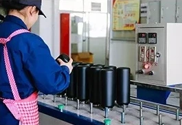 Technician inspecting Hydro Flask for leaks and defects