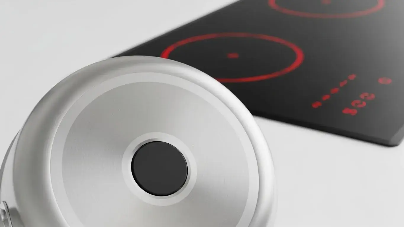 Induction-ready pan base Cookware base with magnet sticking to it